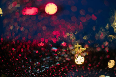 Defocused image of illuminated lights at night