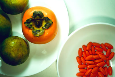 High angle view of fruits in plate on table