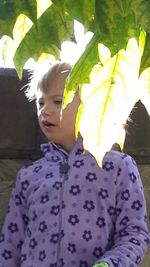 Portrait of cute girl with leaves