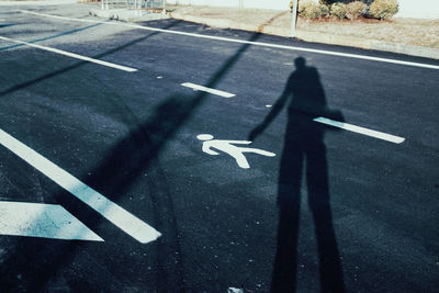 High angle view of arrow symbol on road