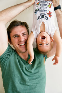 Portrait of smiling boy with father