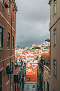 Houses in town against sky