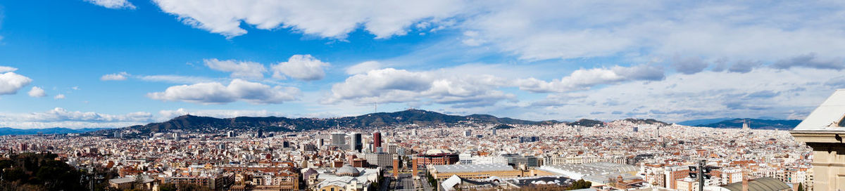 High angle view of townscape against cloudy sky