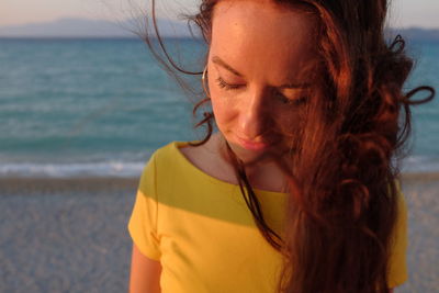 Close-up of beautiful woman at beach