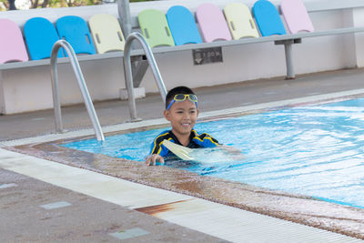 Portrait of boy in swimming pool