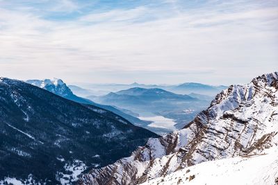 Scenic view of snowcapped mountains against sky