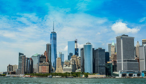 City skyline against cloudy sky