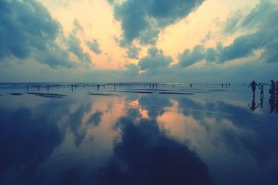 Scenic view of sea against sky at sunset