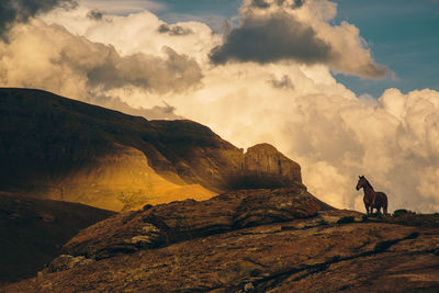 Scenic view of mountains against sky during sunset