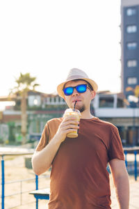 Portrait of boy standing in city