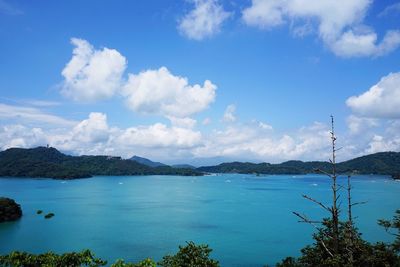 Scenic view of sea against cloudy sky