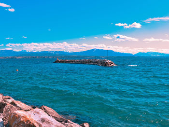 Scenic view of sea against blue sky