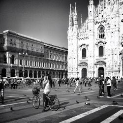Tourists in front of building