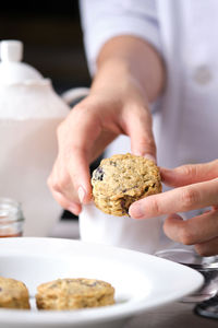 Midsection of man holding ice cream in plate