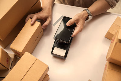 High angle view of woman using mobile phone