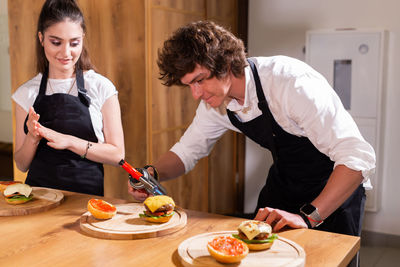 Friends preparing food at home