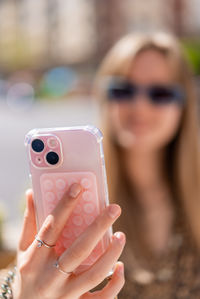 Close-up of woman using mobile phone