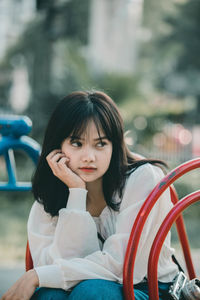 Portrait of woman sitting on seat