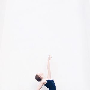 Ballet dancer against white background