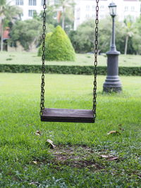 Close-up of swing in park