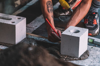 High angle view of man working on concrete