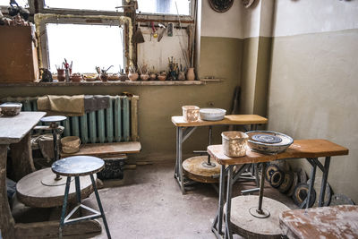 Empty chairs and tables in restaurant