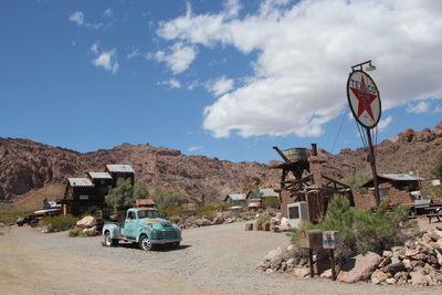 Cars on road against sky