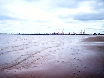 Scenic view of beach against sky