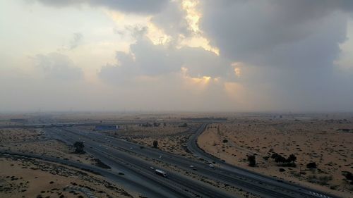 Panoramic view of beach against sky during sunset