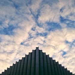 Low angle view of building against cloudy sky