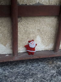 High angle view of red figurine on wall