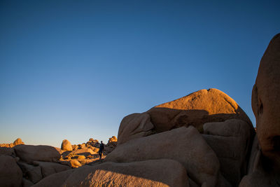 Man standing on rocks in joshua tree national park