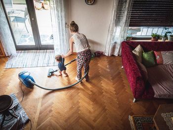 High angle view of people on hardwood floor at home