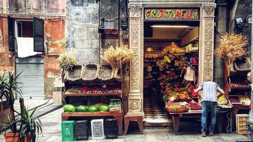 Woman standing at market stall