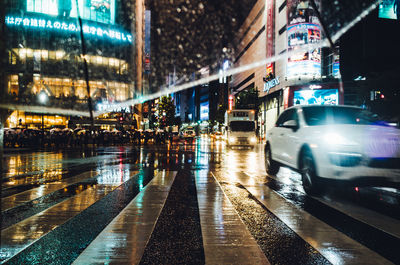 Wet road in city at night