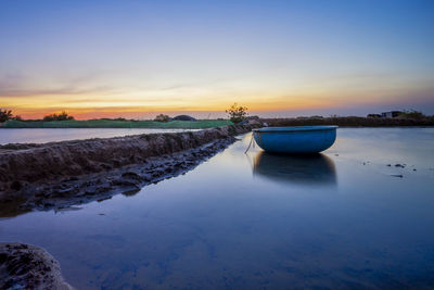 Scenic view of rocks against sky during sunset