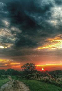 Scenic view of landscape against cloudy sky