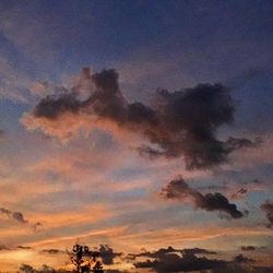 Low angle view of cloudy sky at sunset