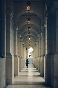 Man walking in corridor