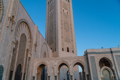 Low angle view of historical building against clear blue sky