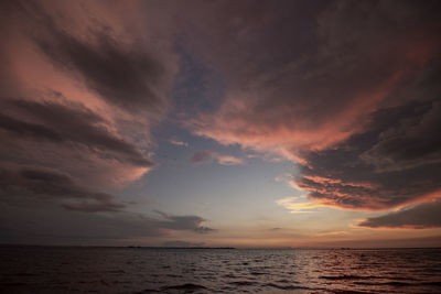 Storm clouds and a brilliant sunset over gulf in st. petersburg, fl
