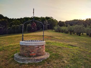 Built structure on field against sky