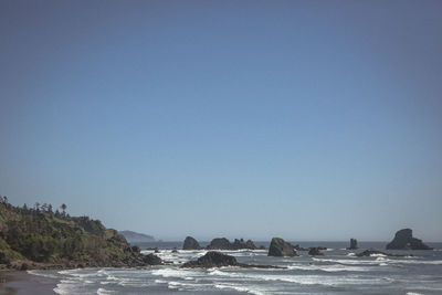 Scenic view of sea against clear blue sky