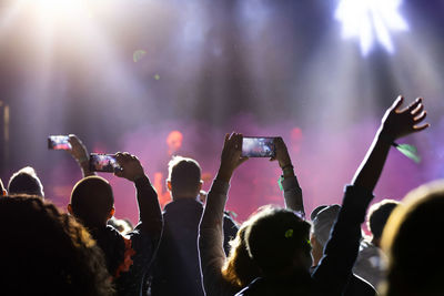 People enjoying music concert at night
