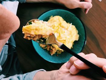 Close-up of man eating food