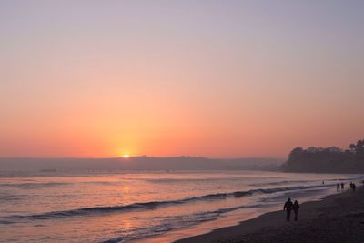 Scenic view of sea at sunset