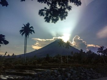 Scenic view of mountains against cloudy sky