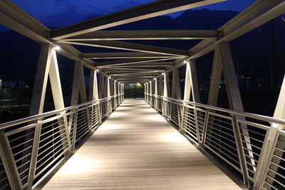 View of elevated walkway at night