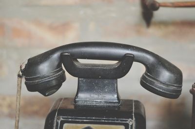 Close-up of old camera on table