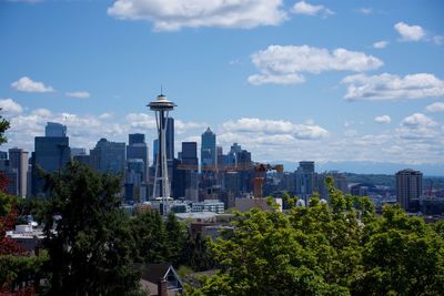 Buildings in city against sky with spaceneedle